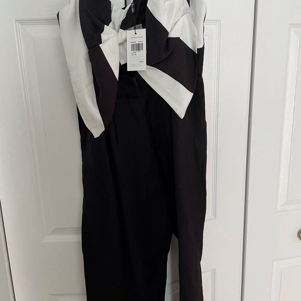 Black jumpsuit never worn. See original tag